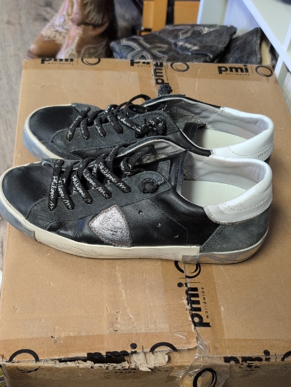 Philippe Model Prsx Low sneakers in a distressed black and silver leather.